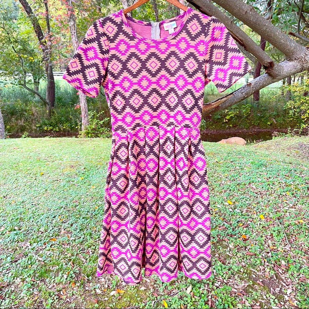 Very cool pink Lula roe dress with funky pattern. Size small.